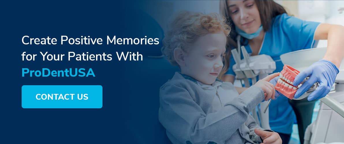 young boy getting a prize from dental hygienist