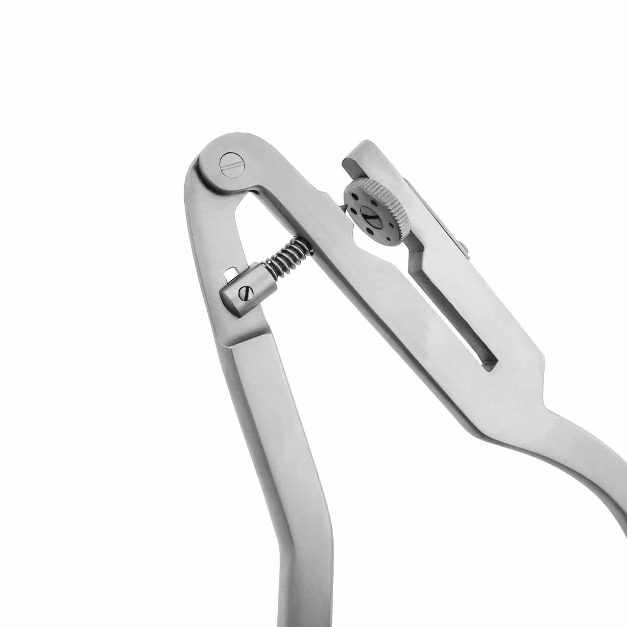 a close up of a dental rubber dam punch