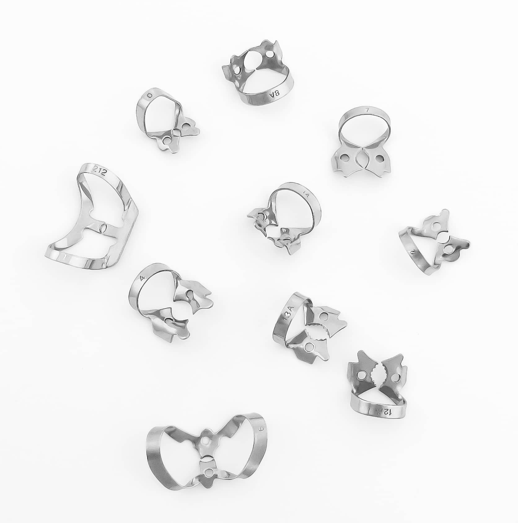 a group of dental rubber dam clamps